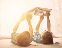 kids-on-floor-in-sun-292x227